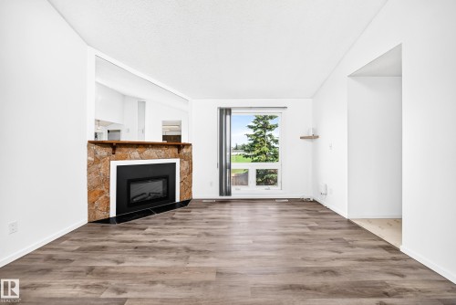 14141 26 Street Nw, Edmonton, AB - Indoor Photo Showing Living Room With Fireplace