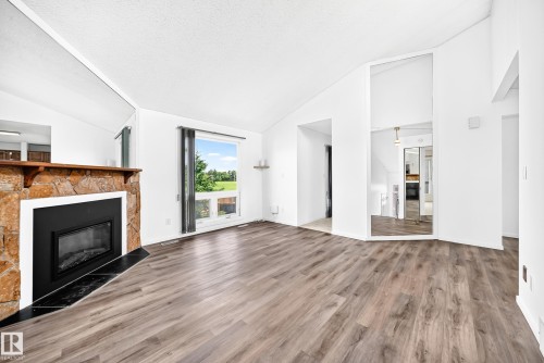 14141 26 Street Nw, Edmonton, AB - Indoor Photo Showing Living Room With Fireplace