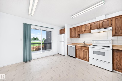 14141 26 Street Nw, Edmonton, AB - Indoor Photo Showing Kitchen With Double Sink