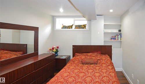 Wood-finish flooring, built-in shelving, recessed lighting, and a transom window - 9657 68A Street Nw, Edmonton, AB 