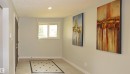 Recessed lighting illuminates the entryway, featuring a tiled floor with a decorative inlay - 9657 68A Street Nw, Edmonton, AB 