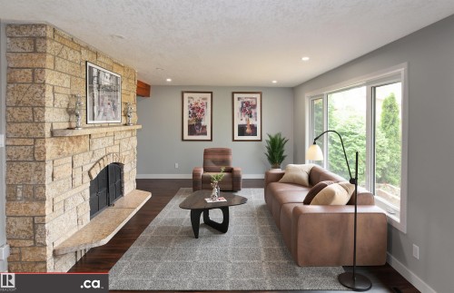 Stone-clad fireplace with hearth, recessed lighting, expansive windows, wood-finish flooring, and light gray wall paint - 9657 68A Street Nw, Edmonton, AB 