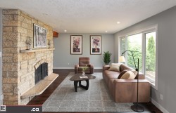 Stone-clad fireplace with hearth, recessed lighting, expansive windows, wood-finish flooring, and light gray wall paint - 