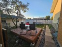 Outdoor wood deck with a mature tree - 8828 151 Avenue Northwest, Edmonton, AB 