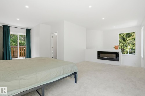 5406 110 Street Nw, Edmonton, AB - Indoor Photo Showing Bedroom With Fireplace