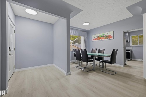 Wood-finish flooring throughout, with a window featuring a valance - 13024 Sherbrooke Avenue Nw, Edmonton, AB 