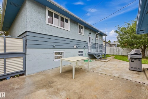 Concrete patio featuring a privacy screen - 13024 Sherbrooke Avenue Nw, Edmonton, AB 