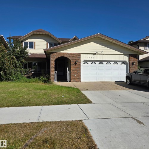Brick and siding exterior with an arched entry - 11022 158 Avenue Nw, Edmonton, AB 
