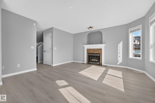 1103 117 Street Sw, Edmonton, AB - Indoor Photo Showing Living Room With Fireplace