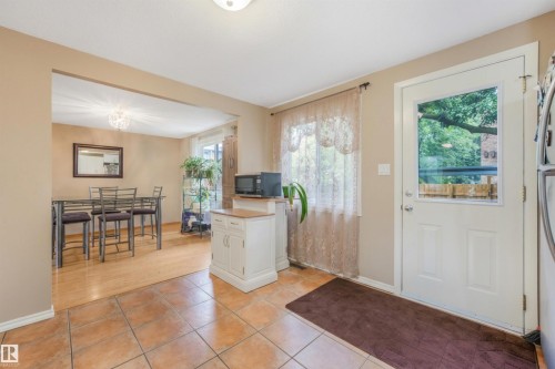 Large Kitchen Space featuring modern white and grey backsplash, stainless steel appliances, butcher block moveable island, and BRAND NEW COUNTERTOPS! - 267 Ridgewood Terrace, St. Albert, AB - Indoor