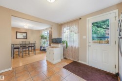 Large Kitchen Space featuring modern white and grey backsplash, stainless steel appliances, butcher block moveable island, and BRAND NEW COUNTERTOPS! - 