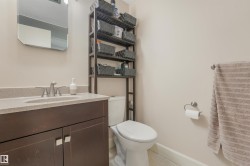 Upstairs 4 Piece Bathroom featuring additional above toilet shelving unit. - 