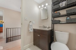 Upstairs 4 Piece Bathroom featuring additional above toilet shelving unit. - 