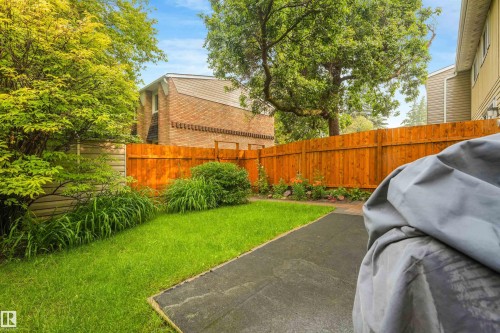 Private backyard space featuring a fully fenced area, storage shed, stone walking path, and beautiful landscaping. - 267 Ridgewood Terrace, St. Albert, AB - Outdoor