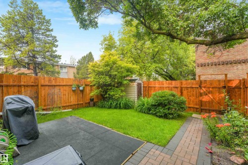 Private backyard space featuring a fully fenced area, storage shed, stone walking path, and beautiful landscaping. - 267 Ridgewood Terrace, St. Albert, AB - Outdoor With Deck Patio Veranda With Backyard