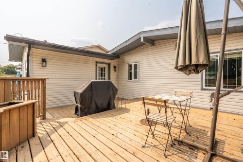 Expansive wooden deck featuring horizontal plank flooring and a wood railing - 5103 50 Street, Cold Lake, AB - Outdoor With Deck Patio Veranda With Exterior