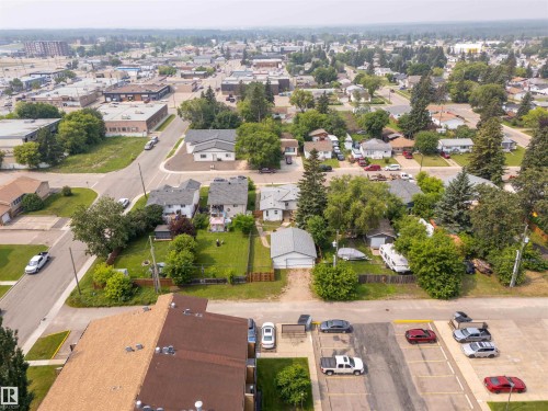 Aerial perspective showcasing a residential neighborhood with a mix of single-family homes and multi-story buildings - 5103 50 Street, Cold Lake, AB - Outdoor With View