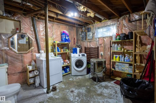 Utility area featuring exposed joists, visible insulation, and a concrete floor - 10428 68 Avenue Nw, Edmonton, AB 