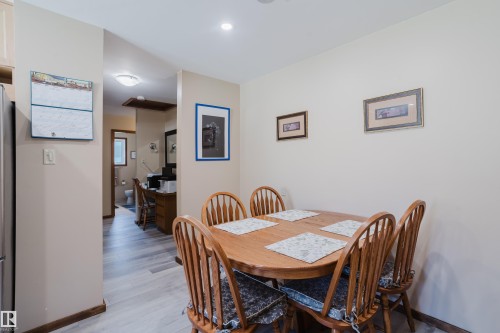 Recessed ceiling lighting, wood-finish flooring, wood trim, and neutral wall tones - 10924 35A Avenue Nw, Edmonton, AB 