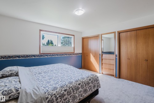 Wall-to-wall carpeting and wood-finish closet doors - 10924 35A Avenue Nw, Edmonton, AB 