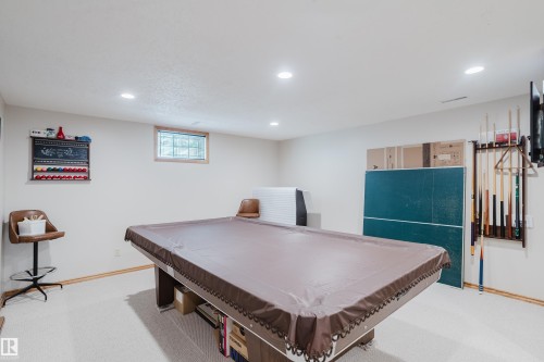 Recessed lighting illuminates the carpeted floor - 10924 35A Avenue Nw, Edmonton, AB 