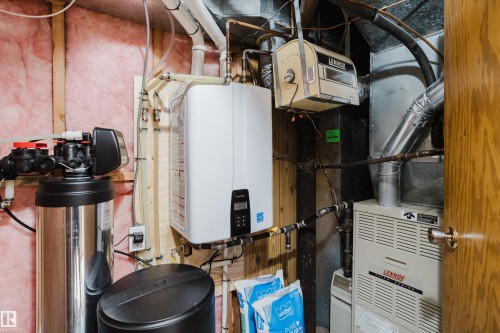 Tankless water heater, water softener system, Lennox furnace, and ductwork - 10924 35A Avenue Nw, Edmonton, AB 