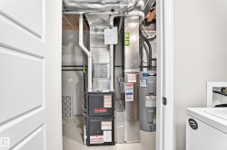 Utility closet with water heater and furnace - 