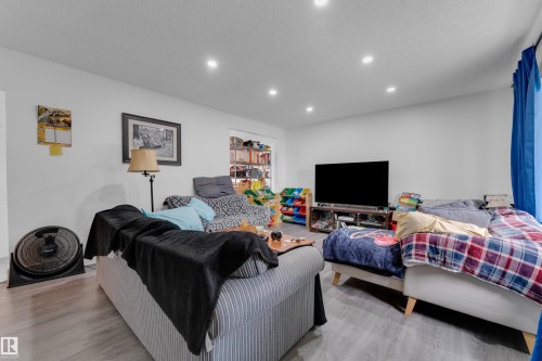Recessed ceiling lighting, light-toned walls, and wood-finish flooring - 14216 58 Street Nw, Edmonton, AB 