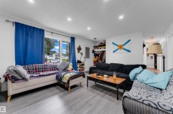 Recessed ceiling lighting, wood-finish flooring, and large windows - 