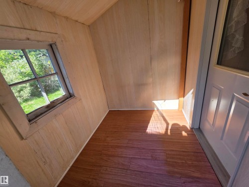 Wood-finish flooring with light wood paneling - 10438 147 Street Nw, Edmonton, AB 