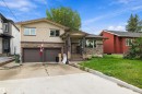 Stucco and stone facade with a covered entry - 10621 60A Avenue Nw, Edmonton, AB 