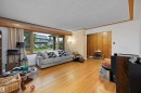 Hardwood flooring with a wide window and wood trim - 10621 60A Avenue Nw, Edmonton, AB 