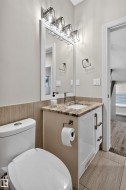 Vanity with a granite countertop, undermount sink, and chrome faucet - 