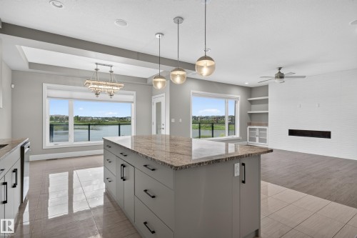 Kitchen island with granite countertop and pendant lighting - 2219 22 Street Nw, Edmonton, AB 