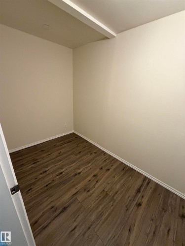 Wood-finish flooring, neutral wall tones, and recessed ceiling lighting - #209 11429 124 St Nw, Edmonton, AB 