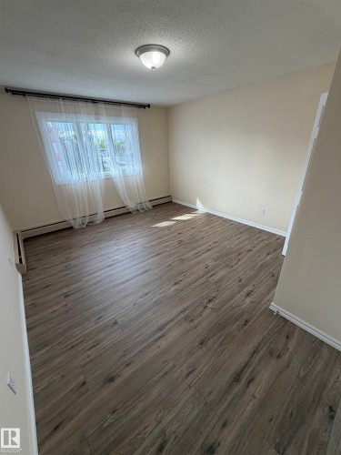 Recessed lighting fixture, wood-finish flooring, and a large window - #209 11429 124 St Nw, Edmonton, AB 