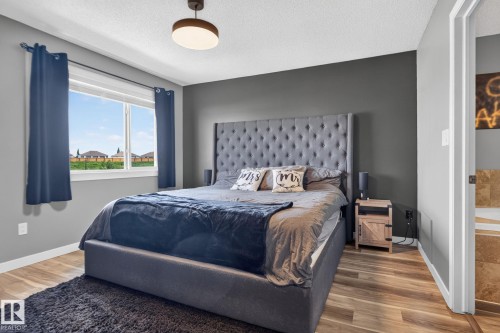 Expansive window offering exterior scenery - 385 Simmonds Way, Leduc, AB - Indoor Photo Showing Bedroom