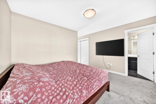 Neutral wall tones, recessed ceiling lighting, sliding closet doors, and carpet flooring - #20 8315 180 Av Nw, Edmonton, AB 