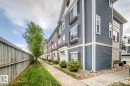 Multi-story facades with horizontal siding and contrasting trim - #20 8315 180 Av Nw, Edmonton, AB 