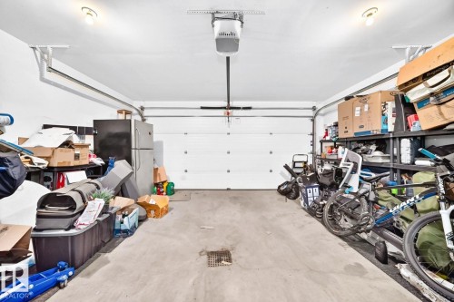 Concrete flooring and overhead garage door opener - #20 8315 180 Av Nw, Edmonton, AB 