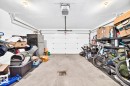 Concrete flooring and overhead garage door opener - #20 8315 180 Av Nw, Edmonton, AB 