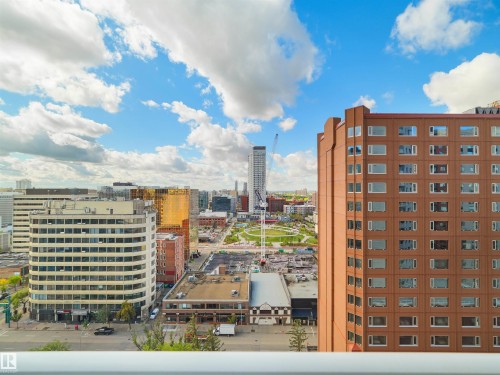 Cityscape with diverse architectural styles, including a prominent high-rise structure - #1601 10136 104 St Nw, Edmonton, AB 