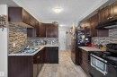 #102 14520 52 St Nw, Edmonton, AB  - Indoor Photo Showing Kitchen With Double Sink With Upgraded Kitchen 