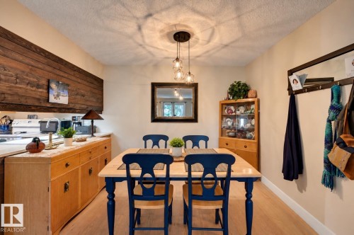 Recessed lighting, wood-finish flooring, and a contemporary ceiling fixture - #203 24 Alpine Pl, St. Albert, AB 