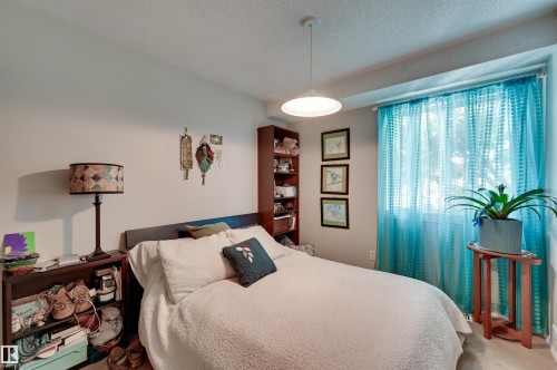 Recessed window with natural light, built-in shelving, and overhead lighting fixture - #203 24 Alpine Pl, St. Albert, AB 