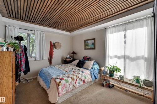 Wood-slat ceiling accent - #203 24 Alpine Pl, St. Albert, AB 