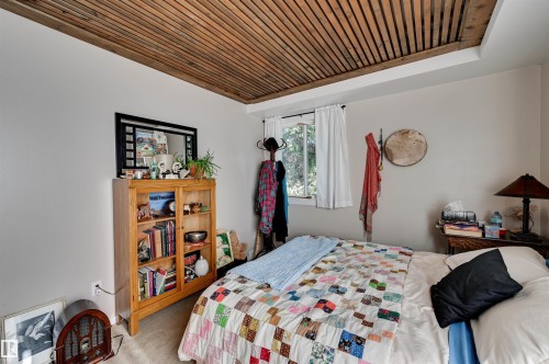 Wood-slat ceiling accent with recessed lighting - #203 24 Alpine Pl, St. Albert, AB 