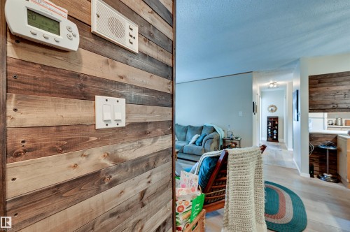 Accent wall with varied wood paneling - #203 24 Alpine Pl, St. Albert, AB 