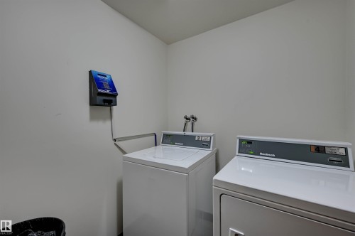 Laundry area featuring a top-load washing machine and a front-load dryer - #203 24 Alpine Pl, St. Albert, AB 