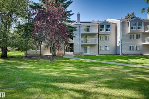 Multi-story building featuring balconies, bay windows, and a prominent chimney - #203 24 Alpine Pl, St. Albert, AB 